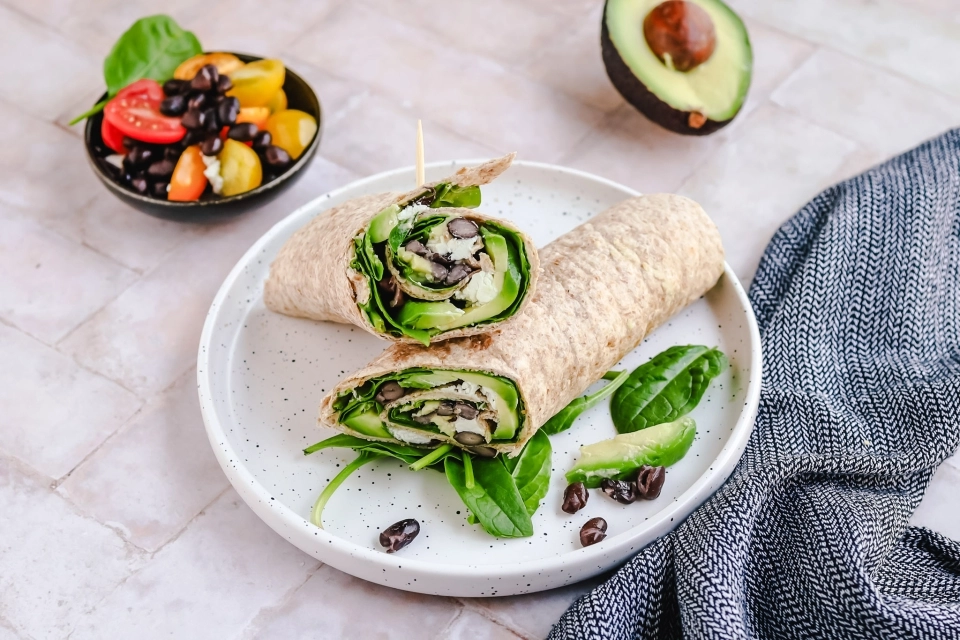 Wrap with hummus, avocado & black beans