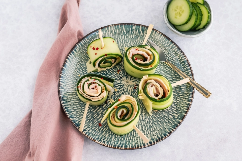 Cucumber roll-ups with hummus, cheese & turkey breast