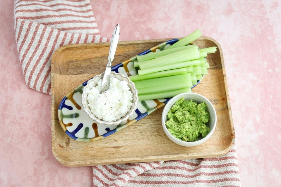 Celery sticks with avocado & cottage cheese